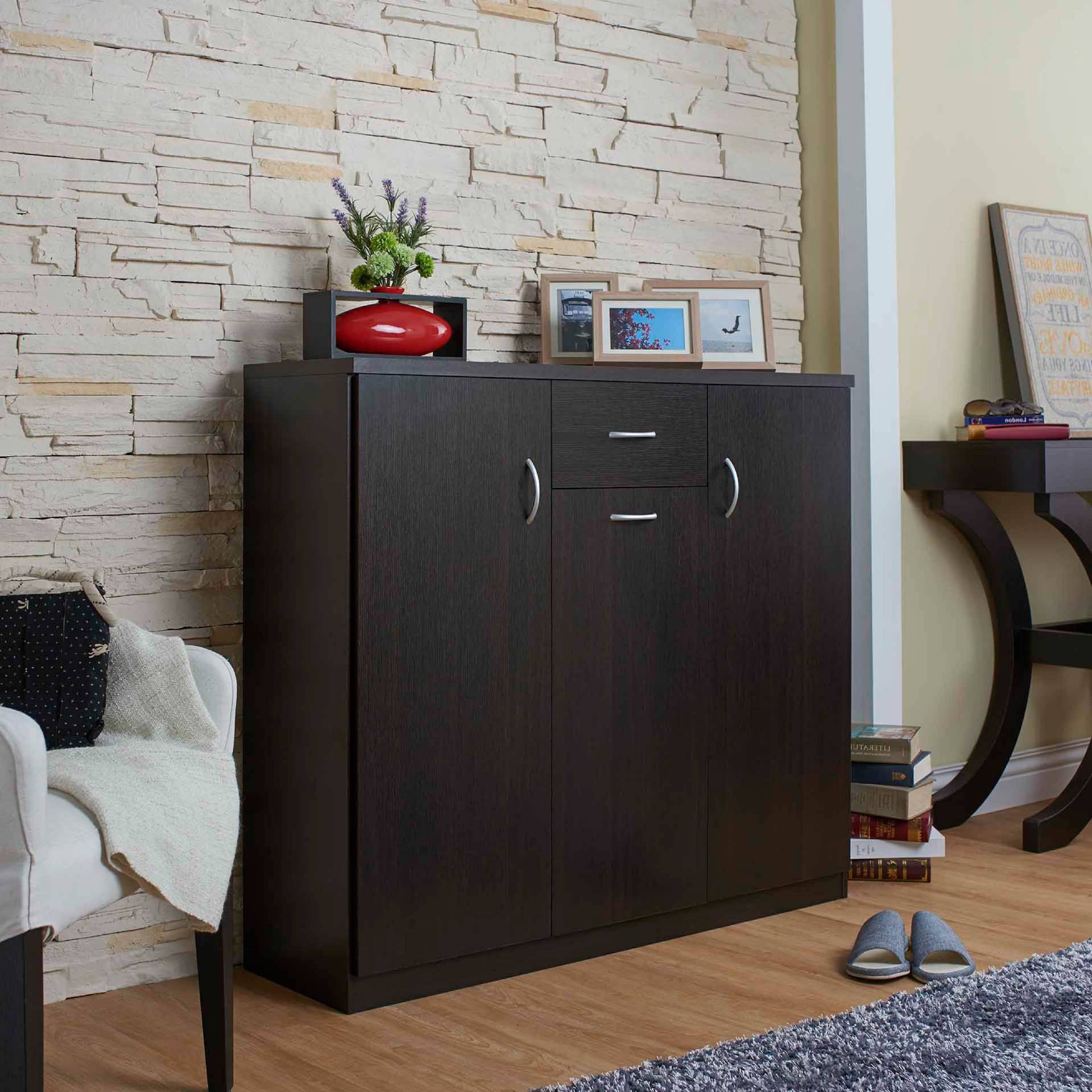 A drawer, laminated storage space, handle a special shape, entrance, dark brown.